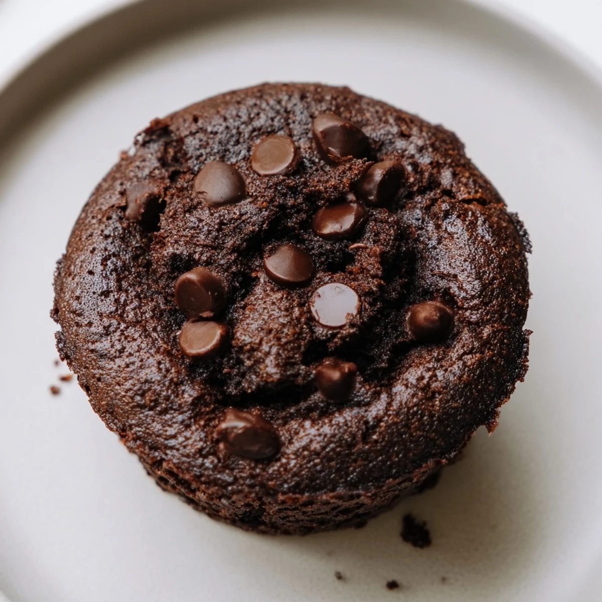 Serving platter of Chocolate Muffin Tops with crispy edges and rich chocolate chips.
