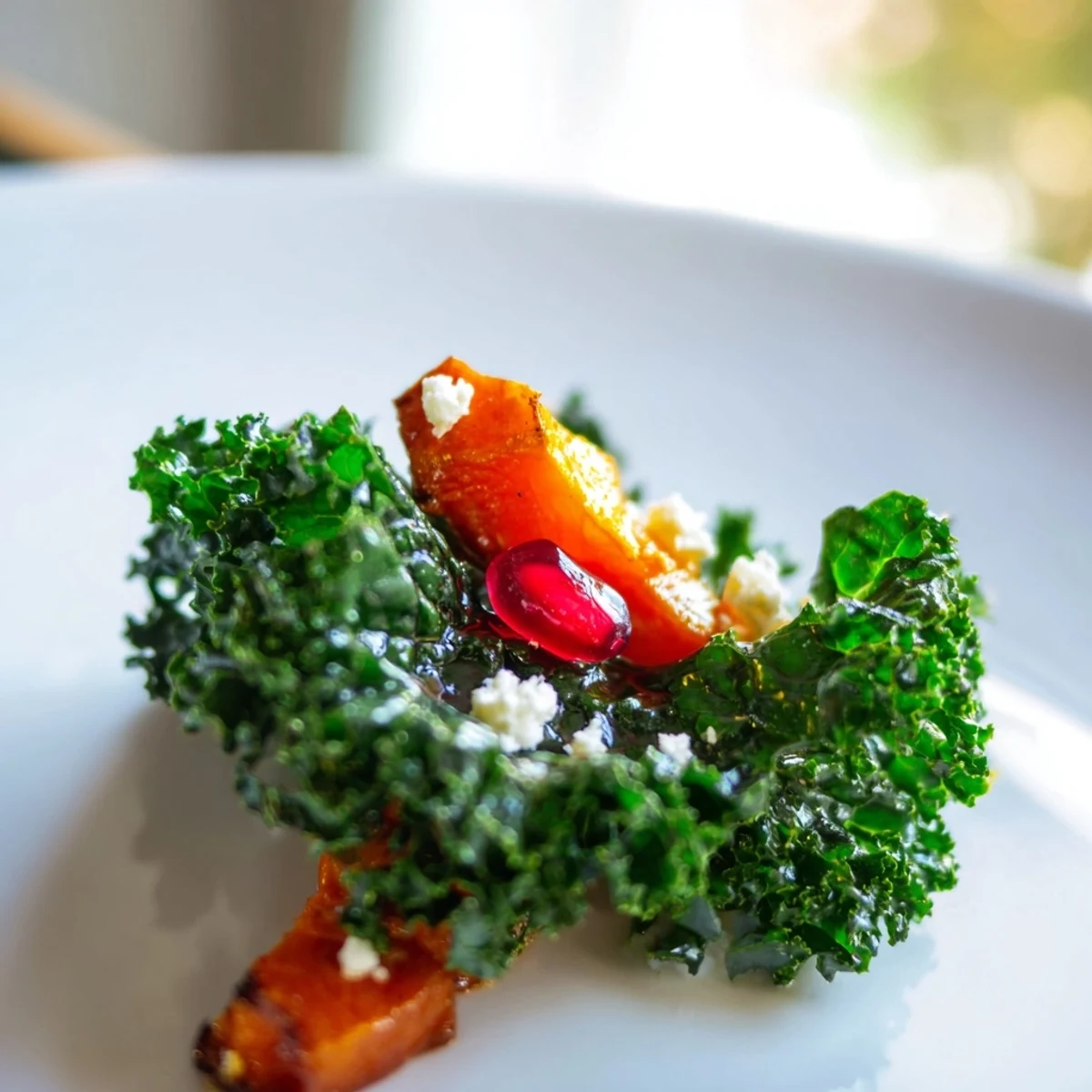 Fresh apple slices and toasted pecans top this hearty, nutrient-packed winter kale salad ready for a cold-weather lunch.