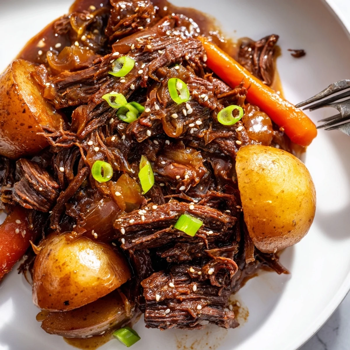 Slow cooker Korean beef pot roast plated with glazed carrots, baby potatoes, and toasted sesame seeds garnish.