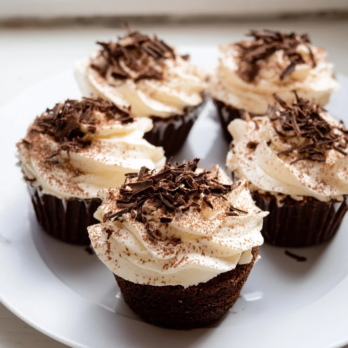 Decadent chocolate cupcakes soaked in coffee syrup with creamy Italian mascarpone topping