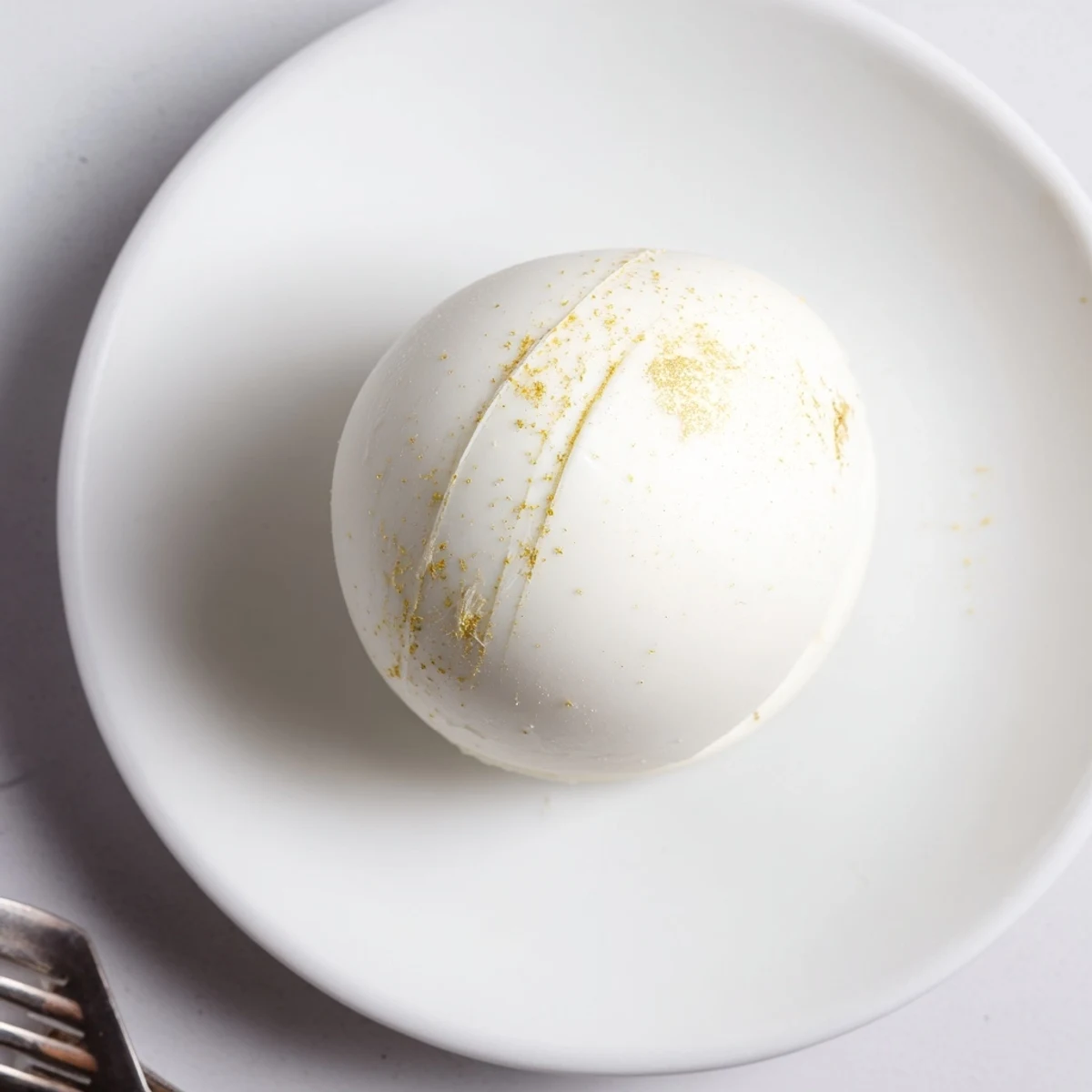 Open chocolate egg shell revealing tender shortcake, juicy strawberries, and fluffy cream