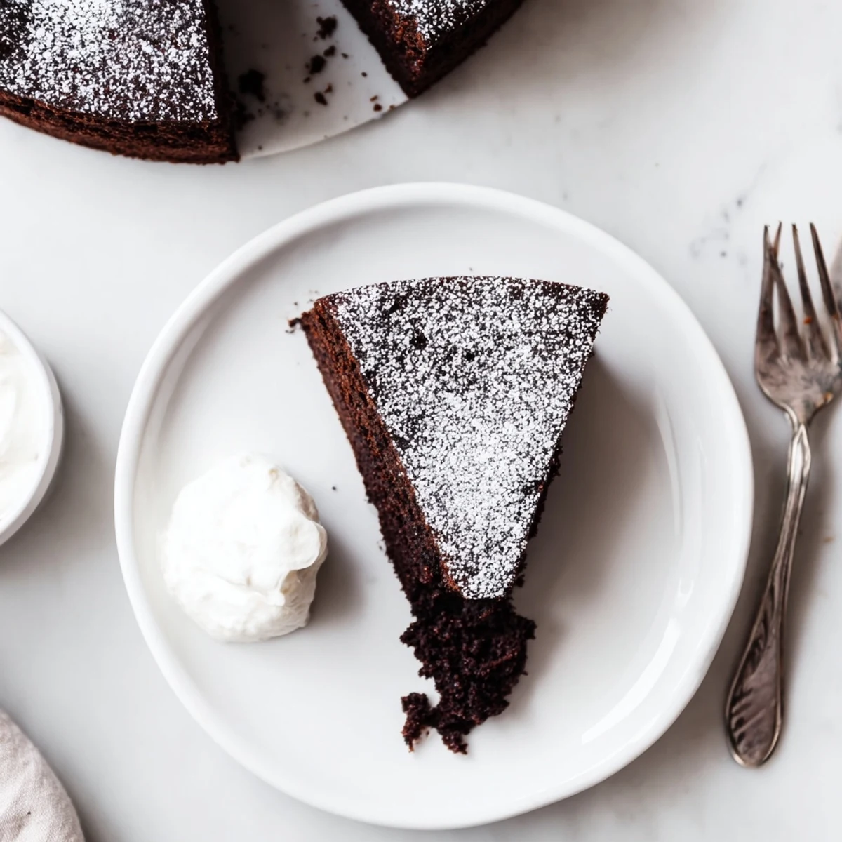 Rich dark chocolate beer cake showing tender crumb texture with vanilla ice cream scoop