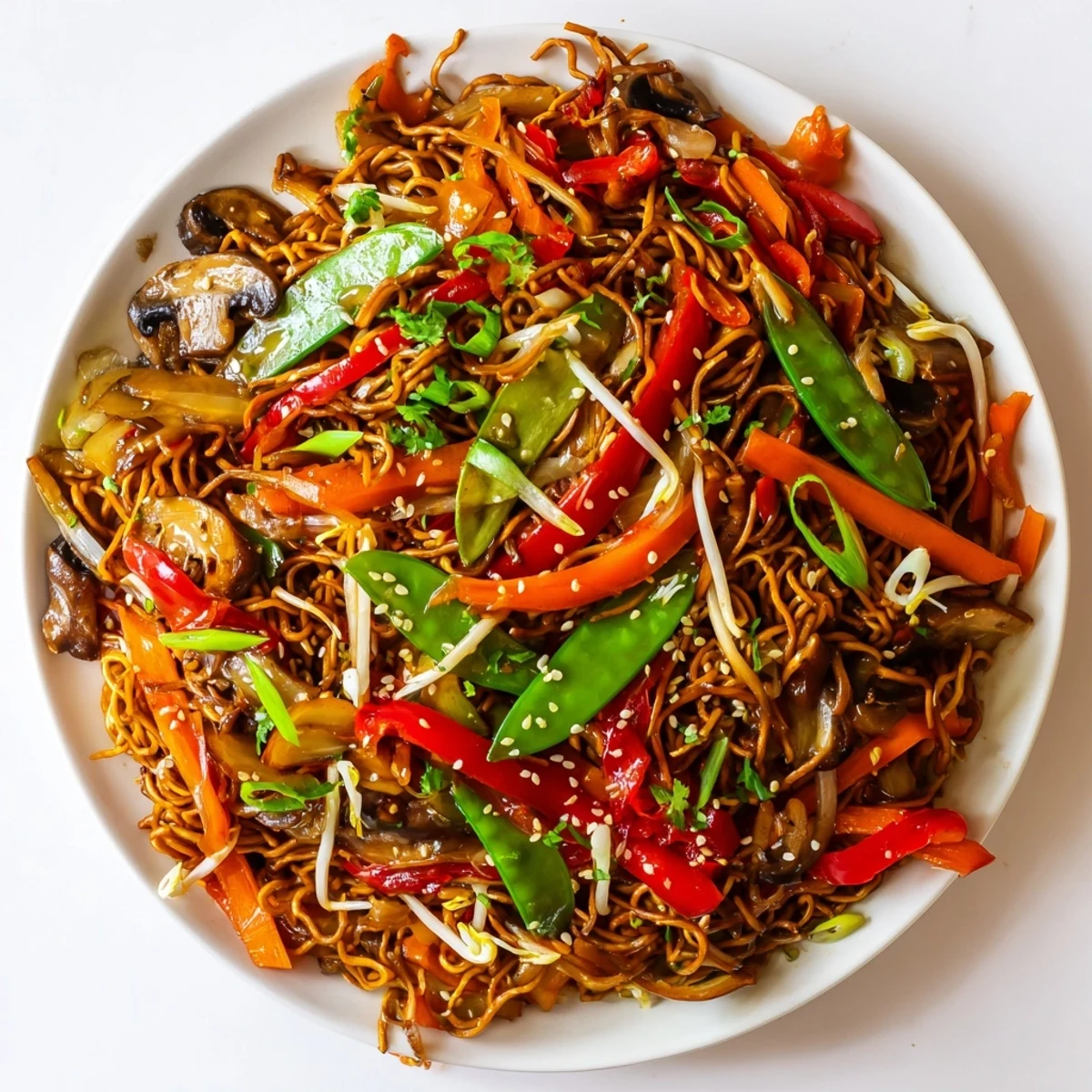 Golden crispy noodle chow mein topped with colorful stir-fried vegetables in savory sauce
