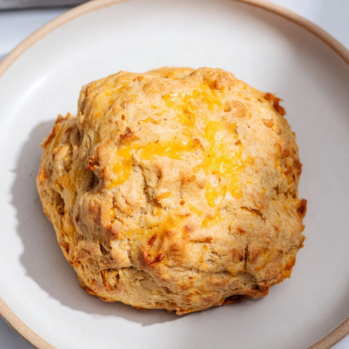 Warm breakfast protein biscuits stacked on a wire cooling rack ready to serve
