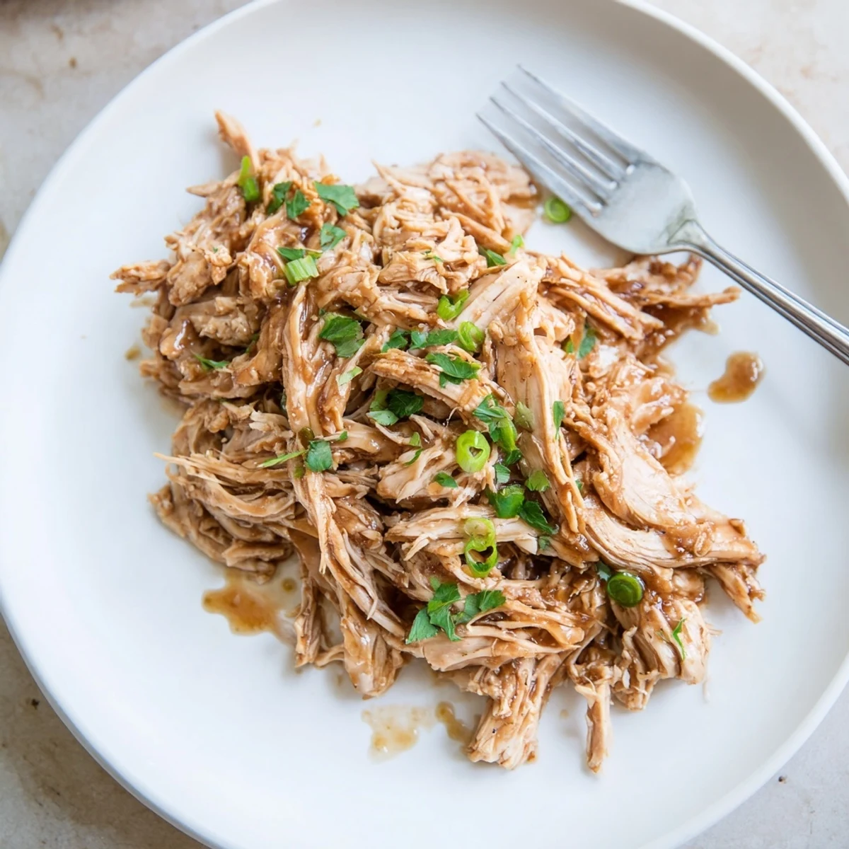 Family style Slow Cooker Brown Sugar Garlic Chicken served hot with chopped parsley.