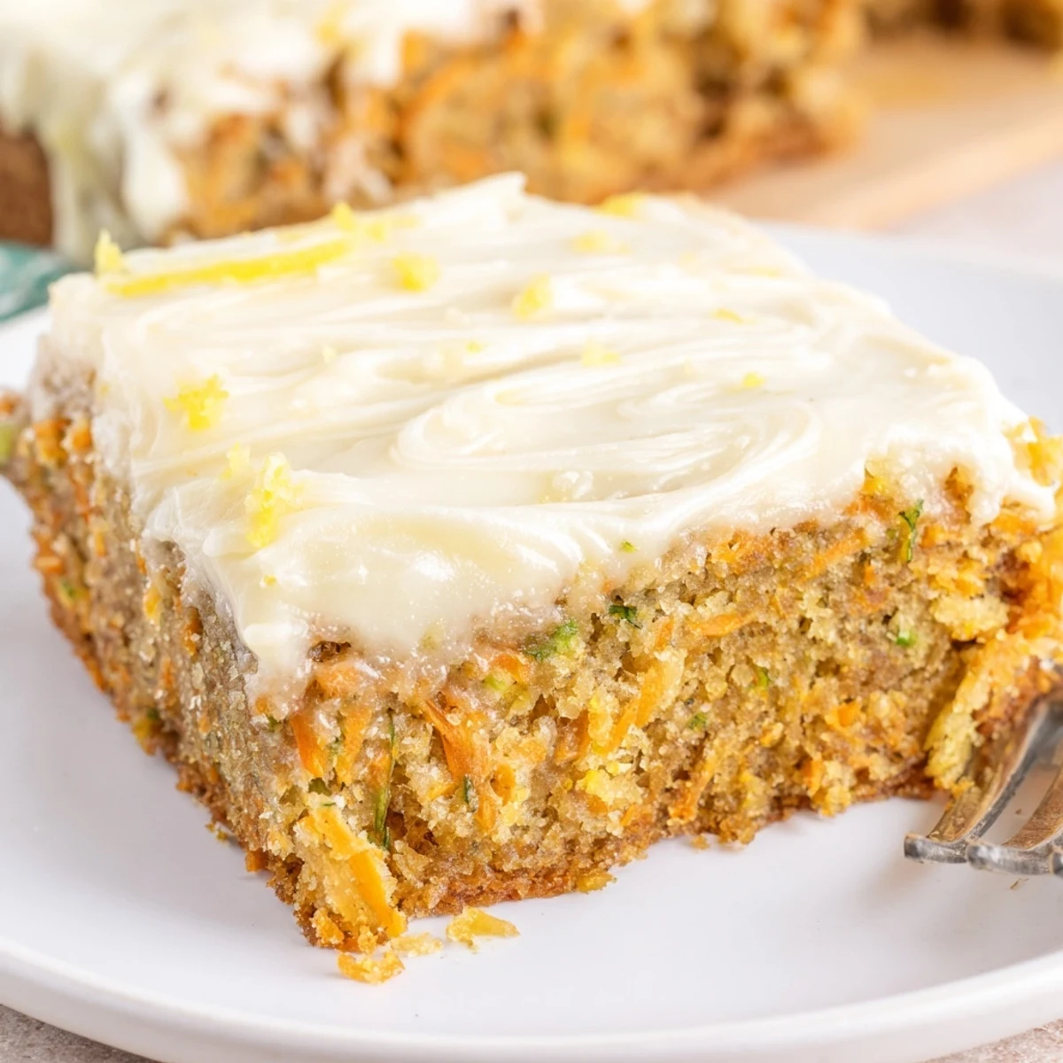 Spiced Ginger Carrot And Zucchini Bars With Lemon Cream Cheese Frosting served with tea