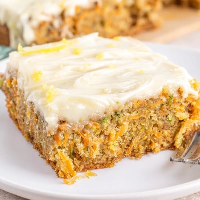 Spiced Ginger Carrot And Zucchini Bars With Lemon Cream Cheese Frosting served with tea